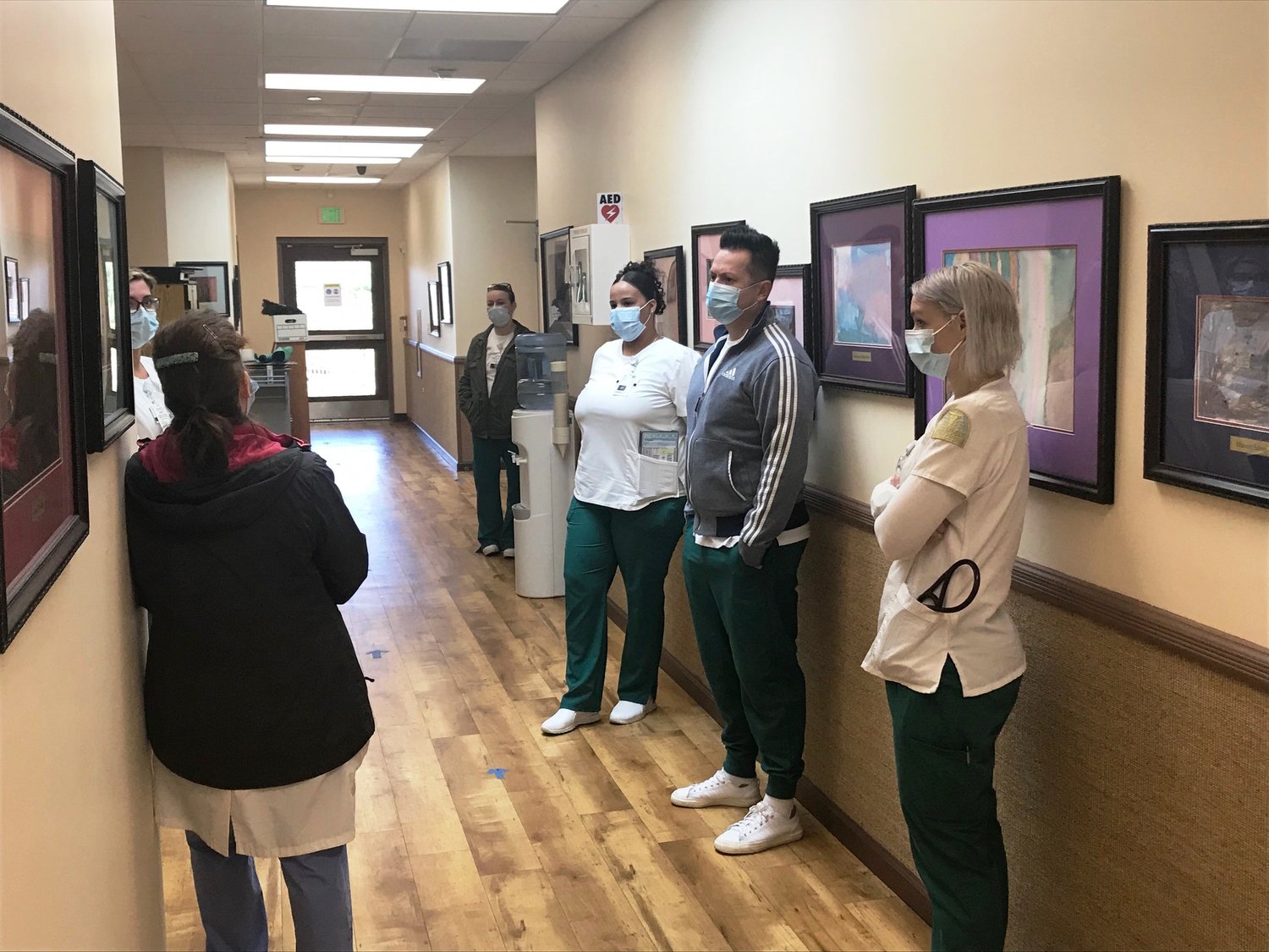 Nursing students meet with their clinical instructor at New Hope Community to receive their assignment and goals for the day.